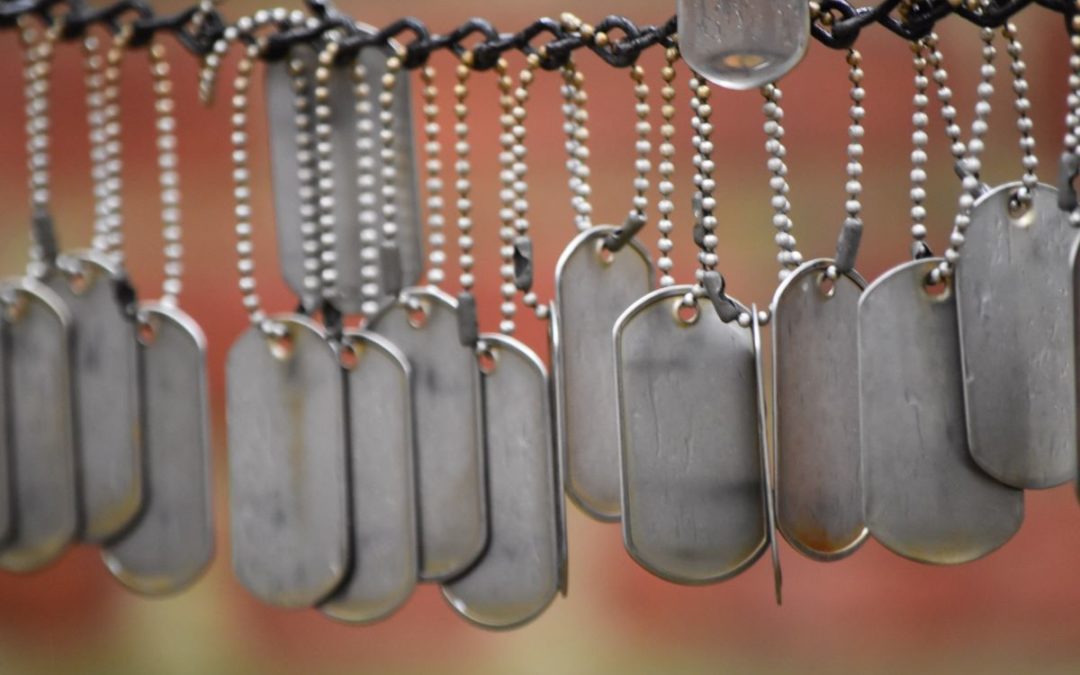 Military dog tags representing the loss of life due to war