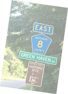 Directional road signs indicating east dutchess county route 8 and green haven road next to a historic site marker.